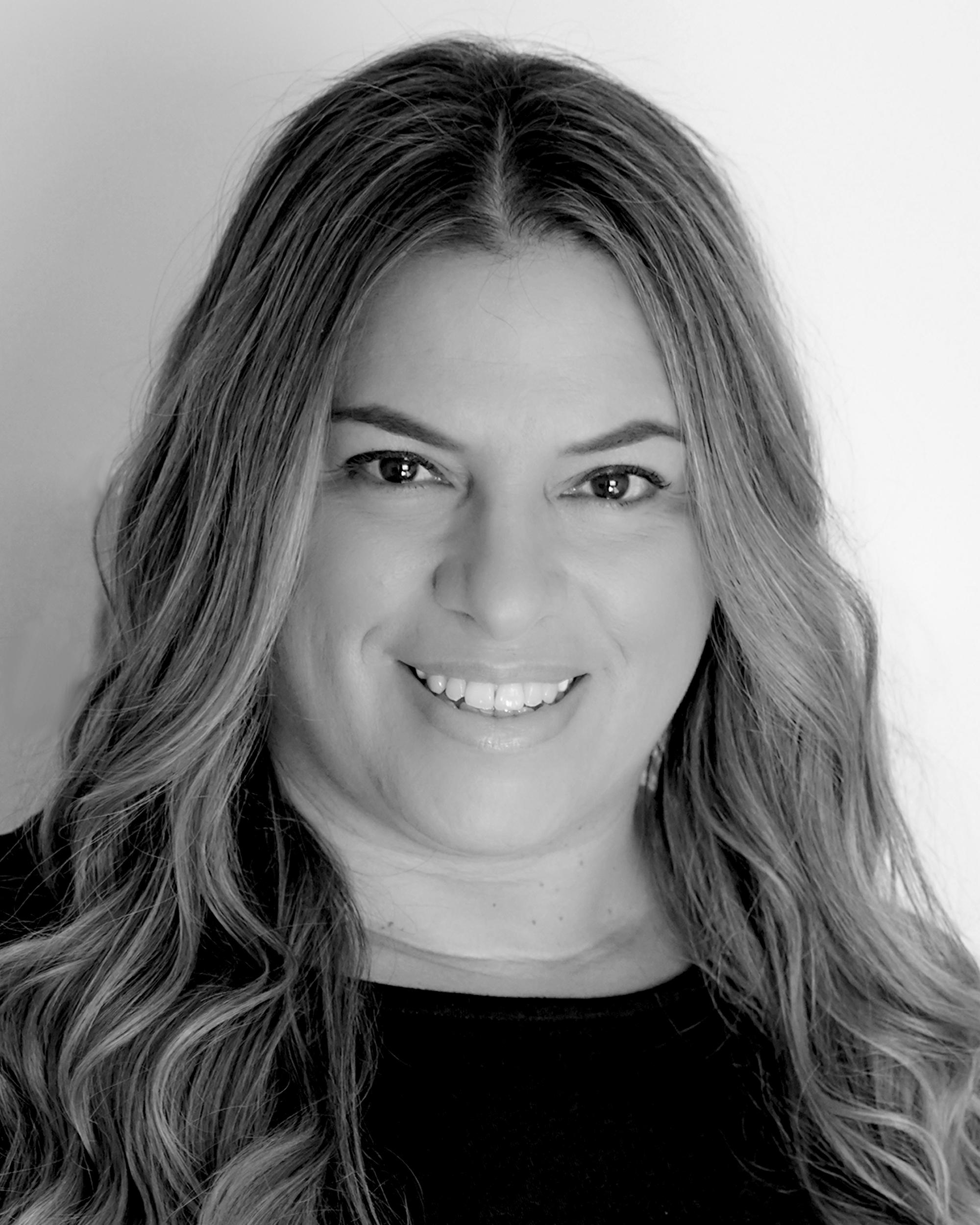 Headshot of Carla Queiroz